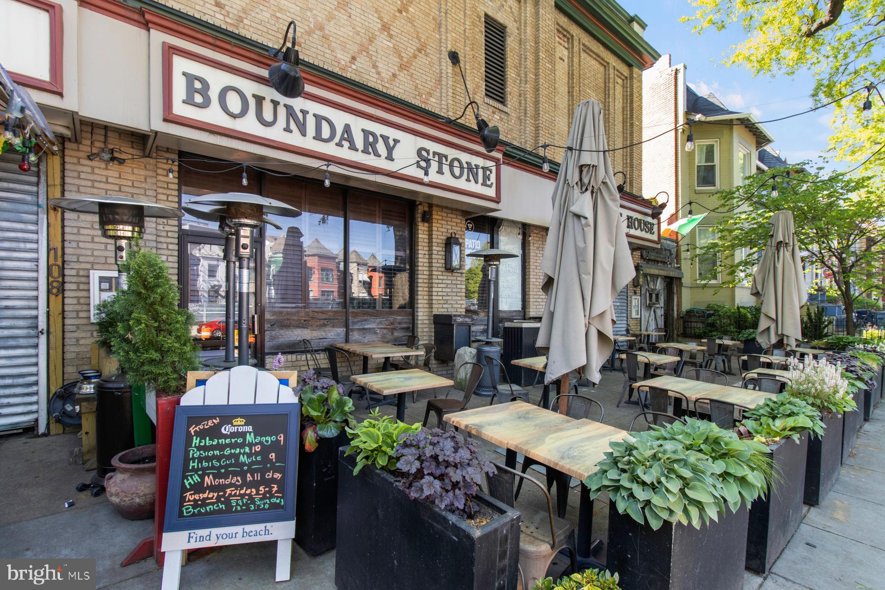 58 T Street Northwest, Unit 1 Washington, DC 20001 - Photo 23 of 27 a store with outdoor seating area and flowers