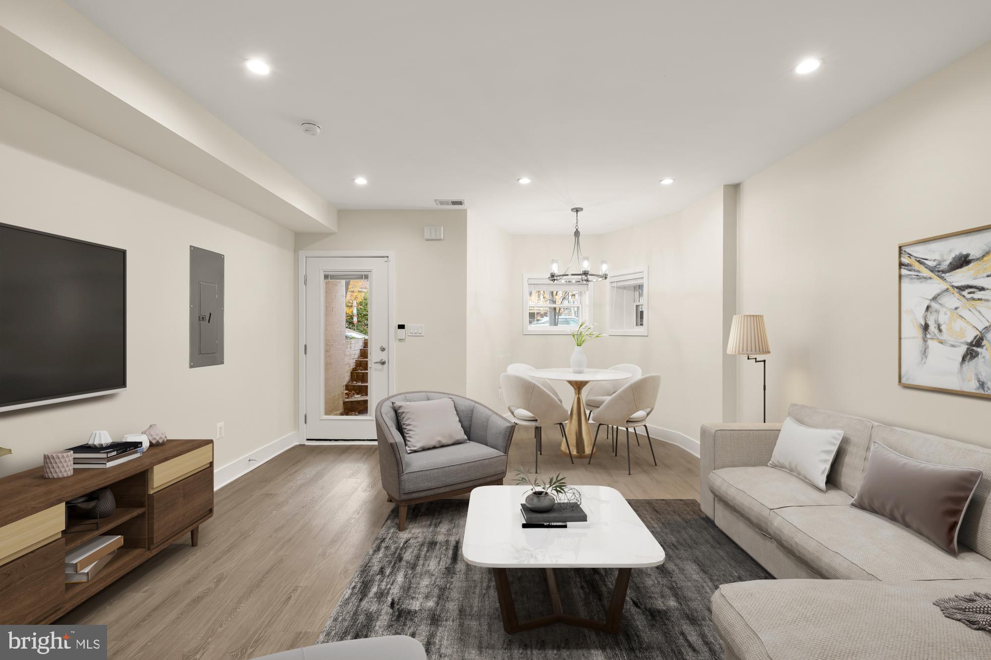 58 T Street Northwest, Unit 1 Washington, DC 20001 - Photo 5 of 27 a living room with furniture and a flat screen tv