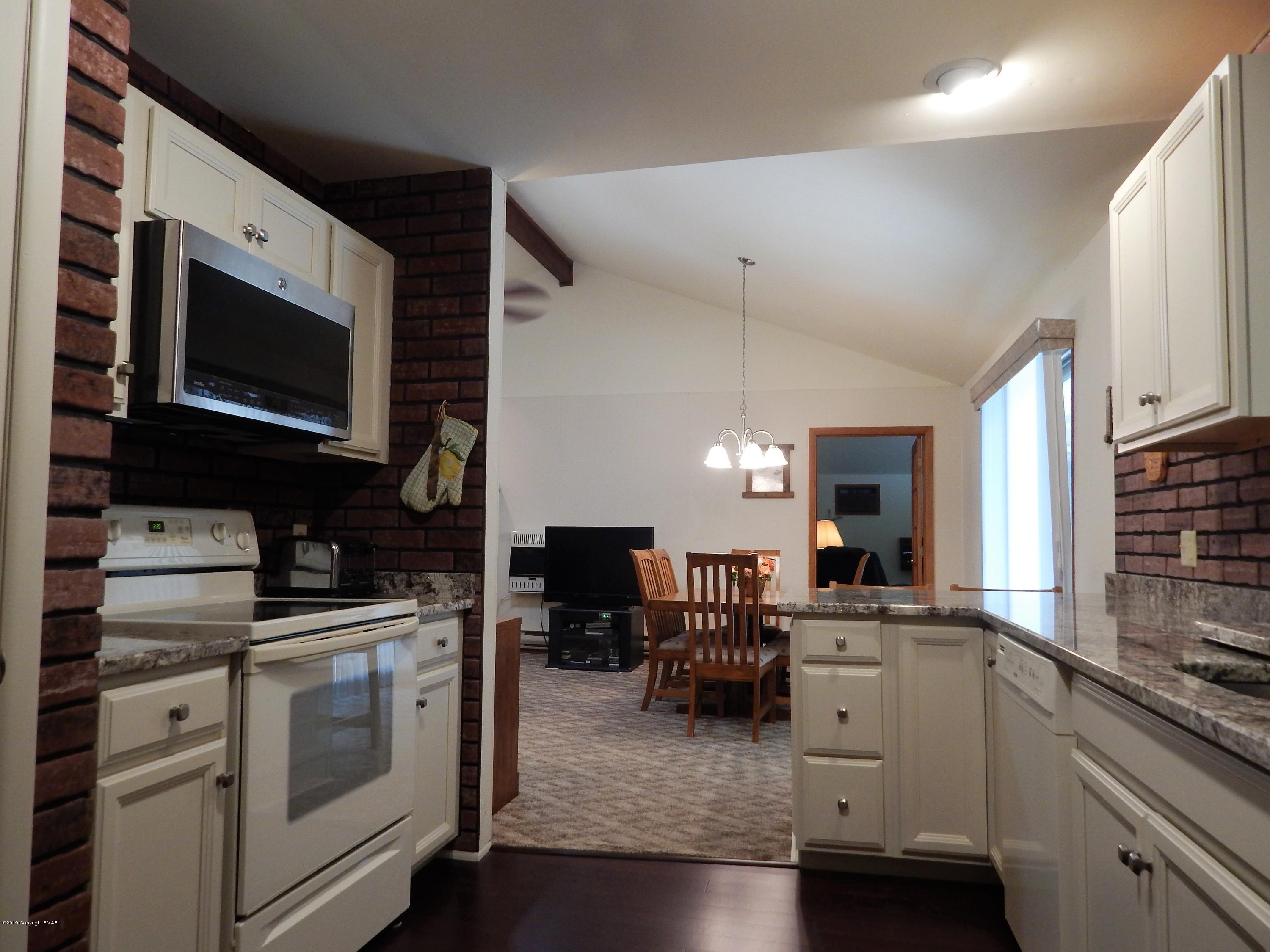 227 Kit Carson Circle Pocono Pines, PA 18350 - Photo 12 of 42 #12-Sapinski From Kitchen to Great Room