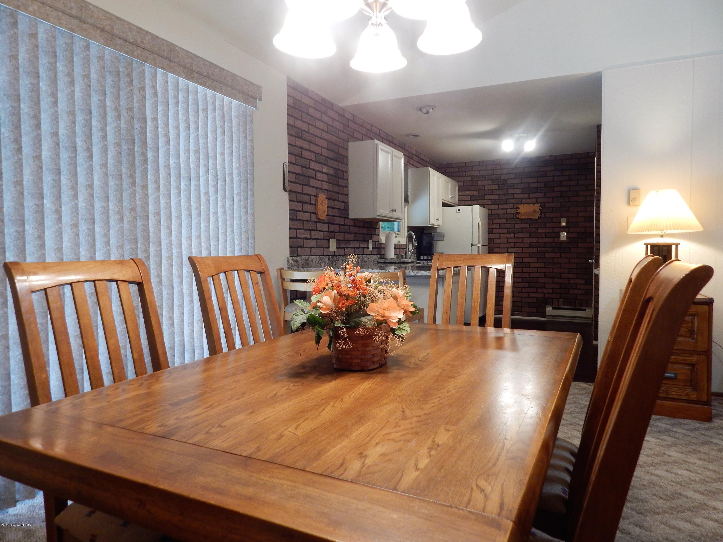 227 Kit Carson Circle Pocono Pines, PA 18350 - Photo 7 of 42 #7-Sapinski Dining Area into Kitchen