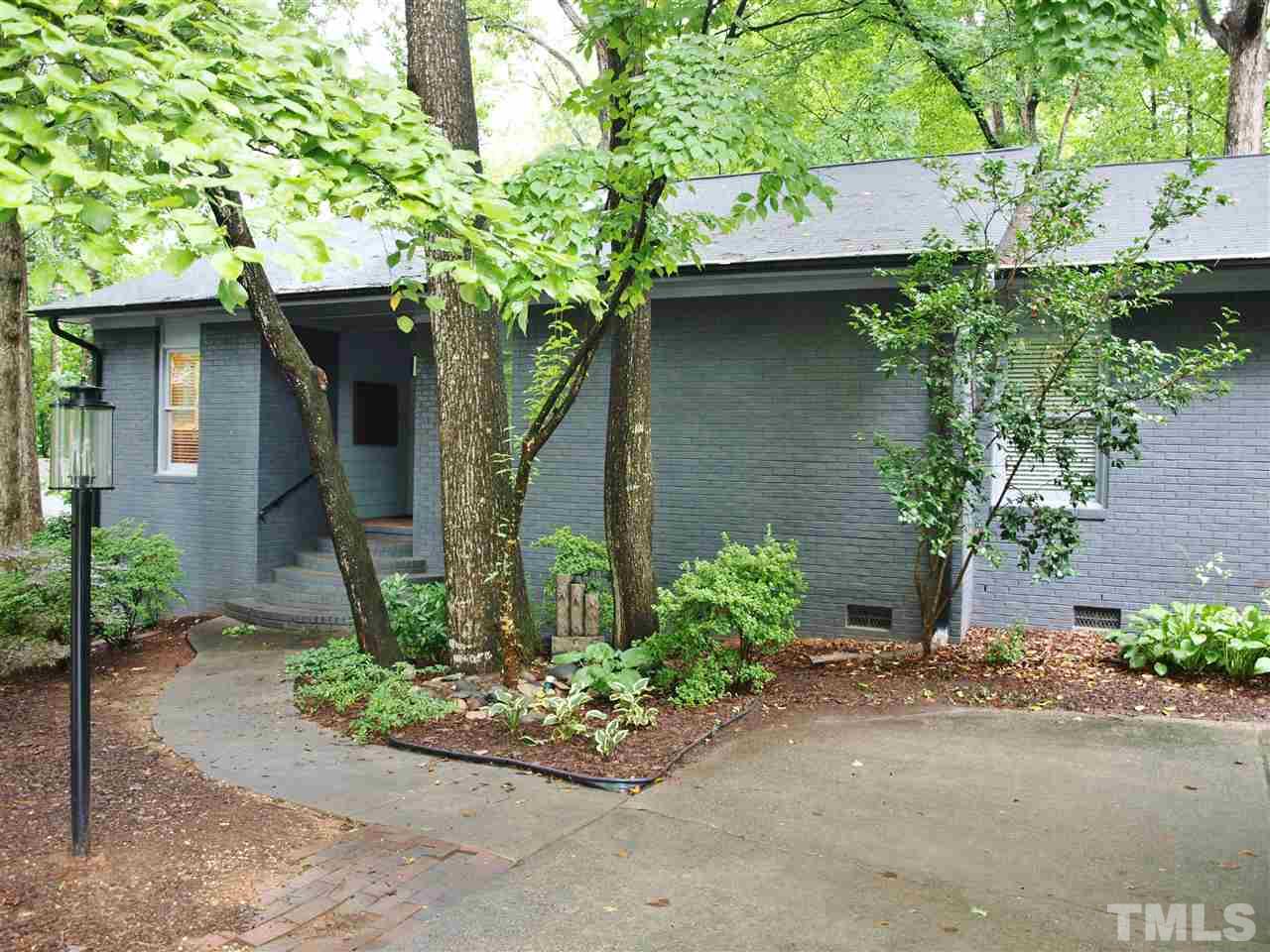 2955 Rue Sans Famille Raleigh, NC 27607 - Photo 1 of 21 a front view of a house with a yard