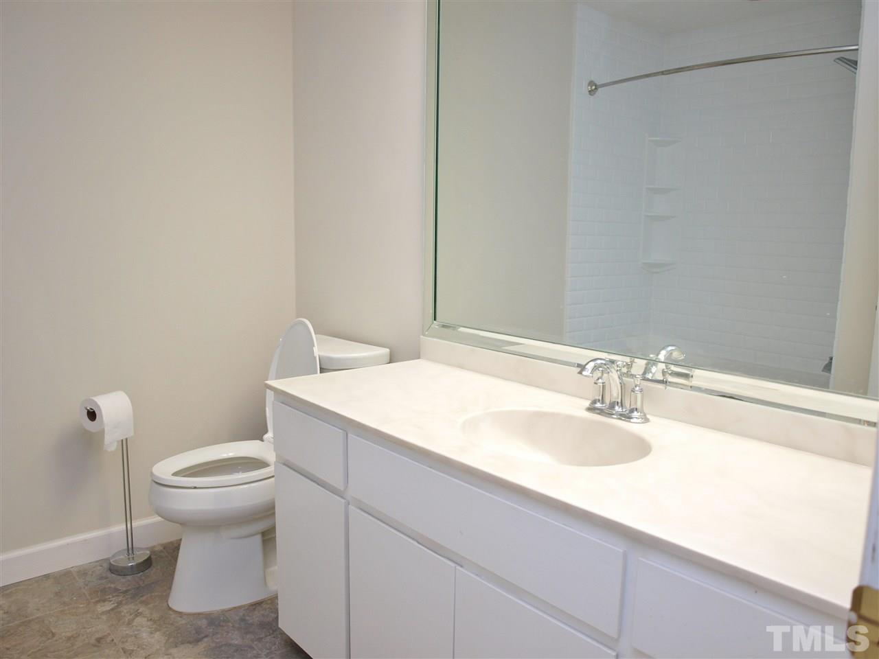 2955 Rue Sans Famille Raleigh, NC 27607 - Photo 11 of 21 a bathroom with a sink and a toilet