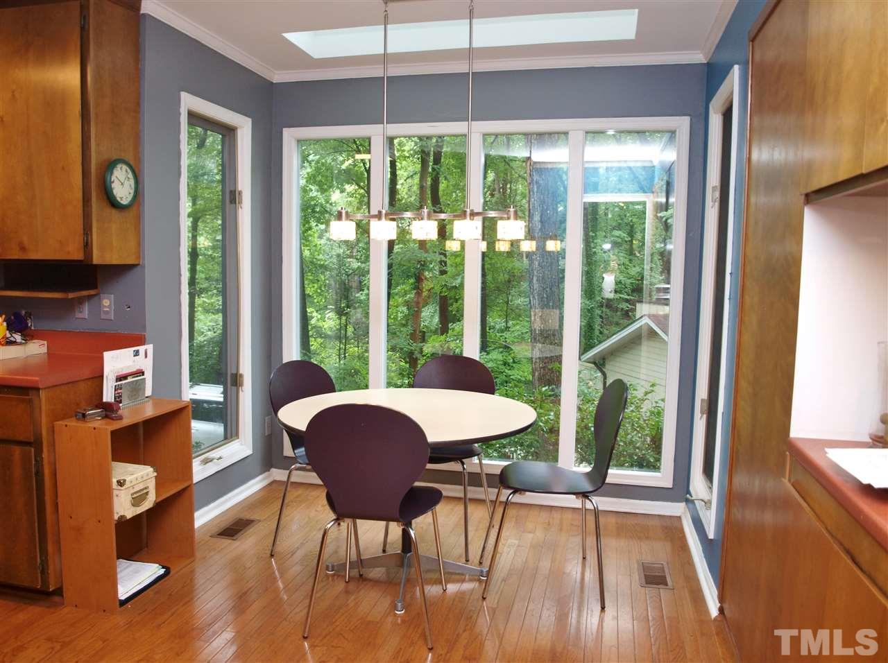 2955 Rue Sans Famille Raleigh, NC 27607 - Photo 6 of 21 a view of a dining room with furniture window and wooden floor