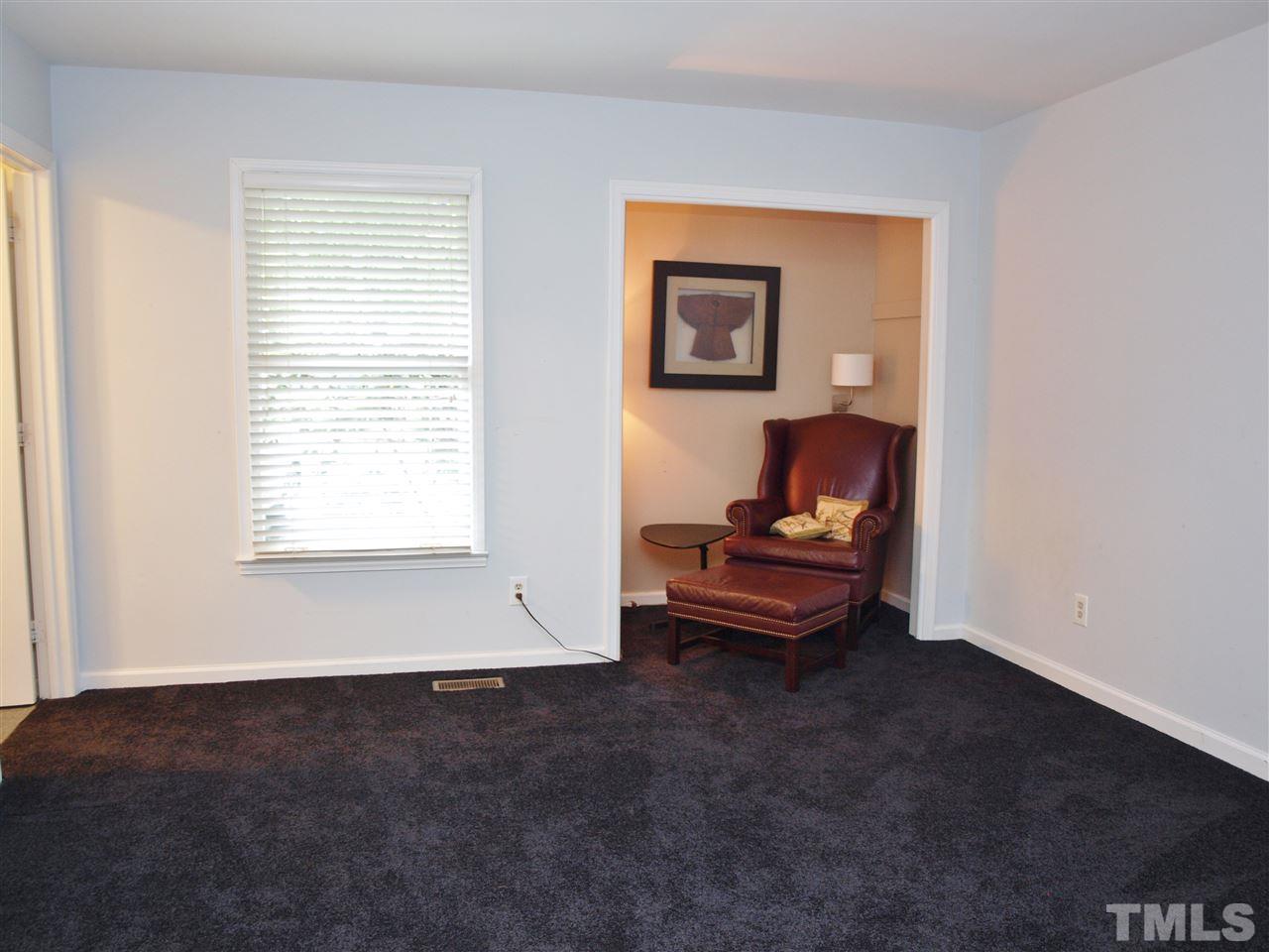 2955 Rue Sans Famille Raleigh, NC 27607 - Photo 8 of 21 a living room with furniture and a window