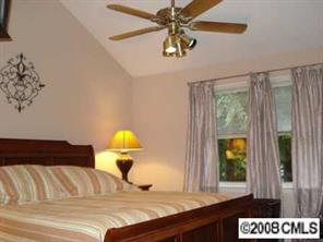 12600 Newstead Road Huntersville, NC 28078 - Photo 5 of 8 a bedroom with a bed and painting on the wall