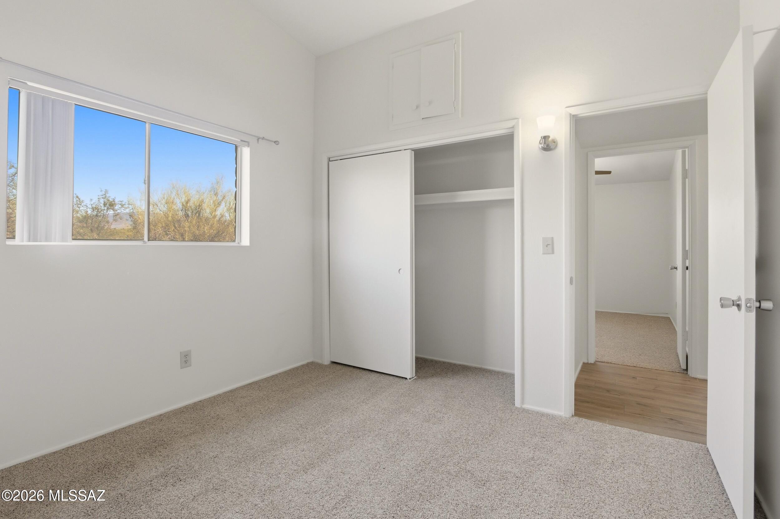9141 East Indian Canyon Road Tucson, AZ 85749 - Photo 25 of 33 a view of an empty room with a window