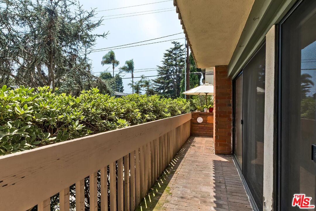 858 12th Street, Unit 4 Santa Monica, CA 90403 - Photo 11 of 18 a view of a balcony with wooden floor