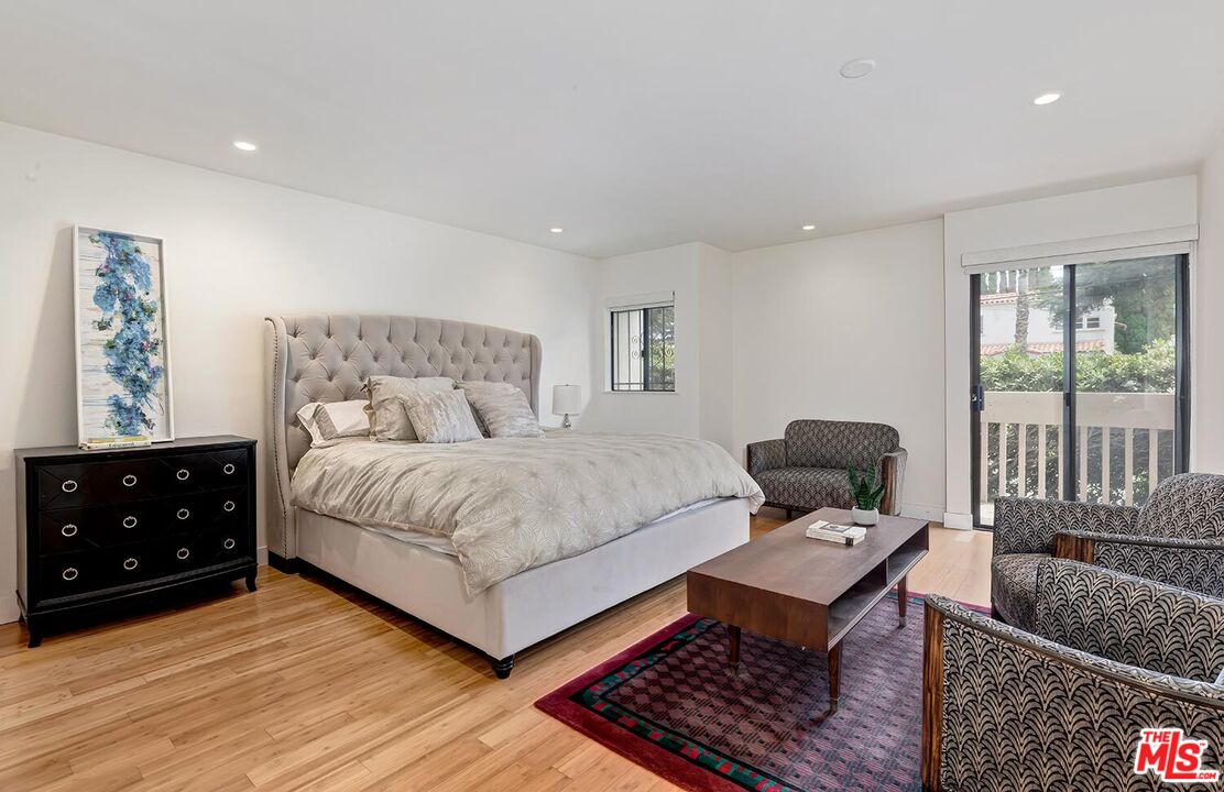 858 12th Street, Unit 4 Santa Monica, CA 90403 - Photo 12 of 18 a bedroom with a bed and wooden floor