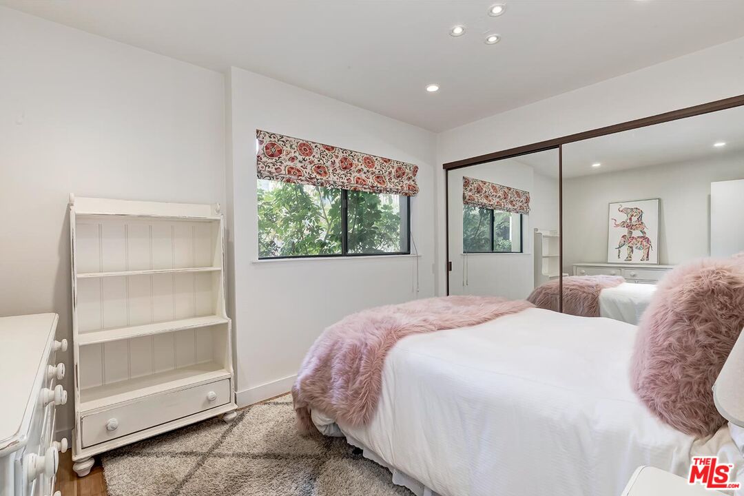 858 12th Street, Unit 4 Santa Monica, CA 90403 - Photo 15 of 18 a spacious bedroom with a large bed and a window
