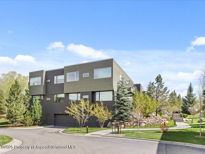 102 Evans Road, Unit 107 Basalt, CO 81621 - Photo 25 of 25 a front view of a house with garden