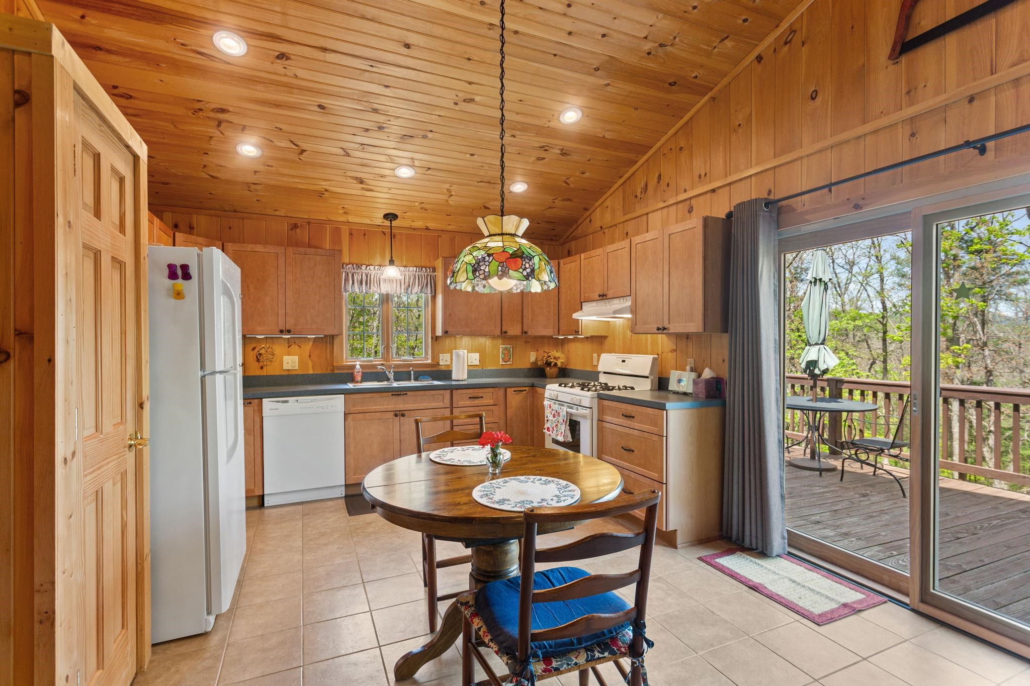 324 Mountaintop Drive Mathias, WV 26812 - Photo 11 of 27 with sliding door to access the deck for morning coffee or evening meals.
