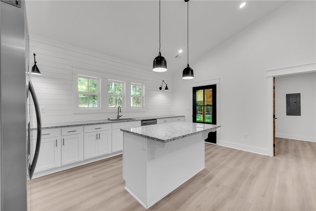 659 White Oak Farms Road Tamassee, SC 29686 - Photo 26 of 50 An airy culinary space pairs vaulted plasterwork with custom shiplap walls and granite-topped prep areas.