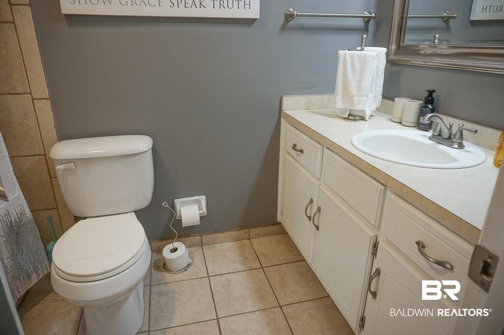 254 Thrift Street Mobile, AL 36609 - Photo 7 of 16 Bathroom featuring vanity and tile patterned floors