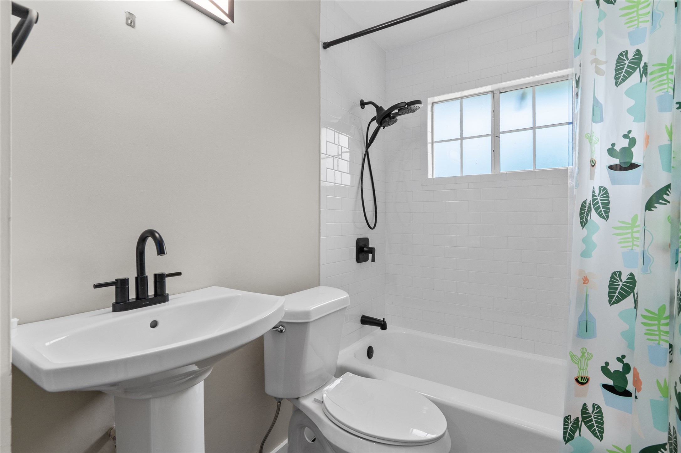 7707 Robalo Road Austin, TX 78757 - Photo 24 of 33 A well-appointed bathroom with contemporary fixtures and subway tile offers a serene and refreshing escape.