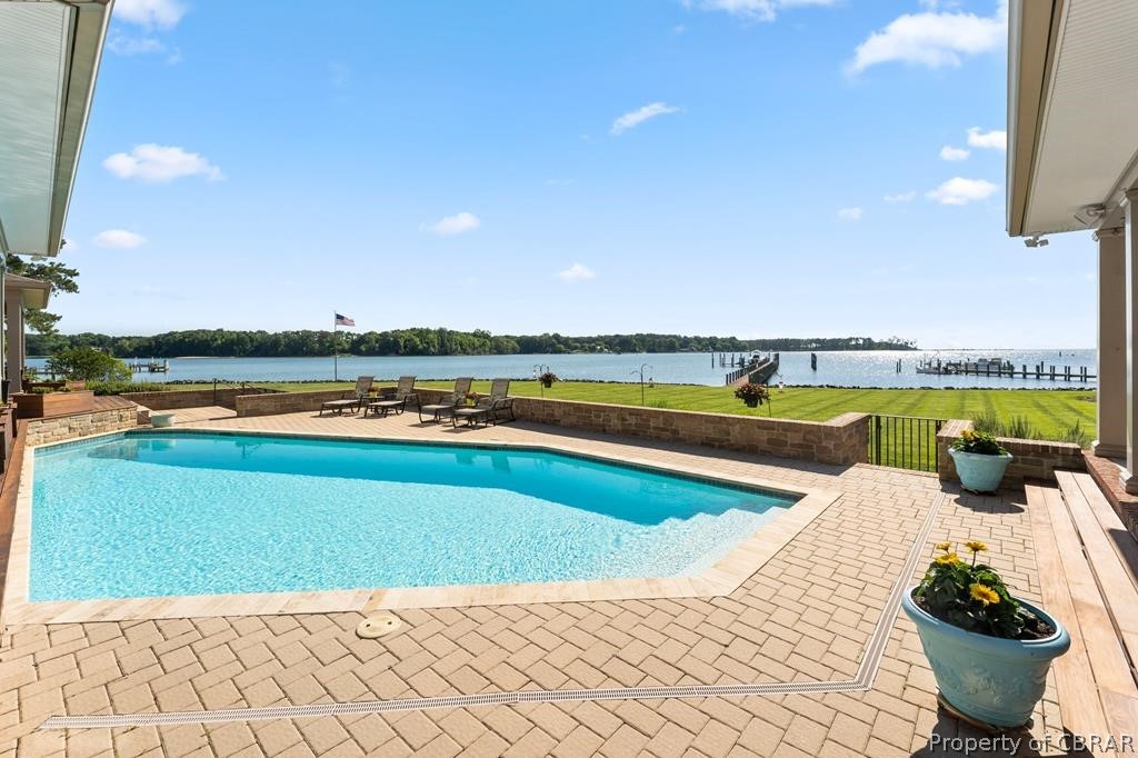 2055 Ditchley Road Kilmarnock, VA 22482 - Photo 41 of 48 View of pool with a water view and a patio
