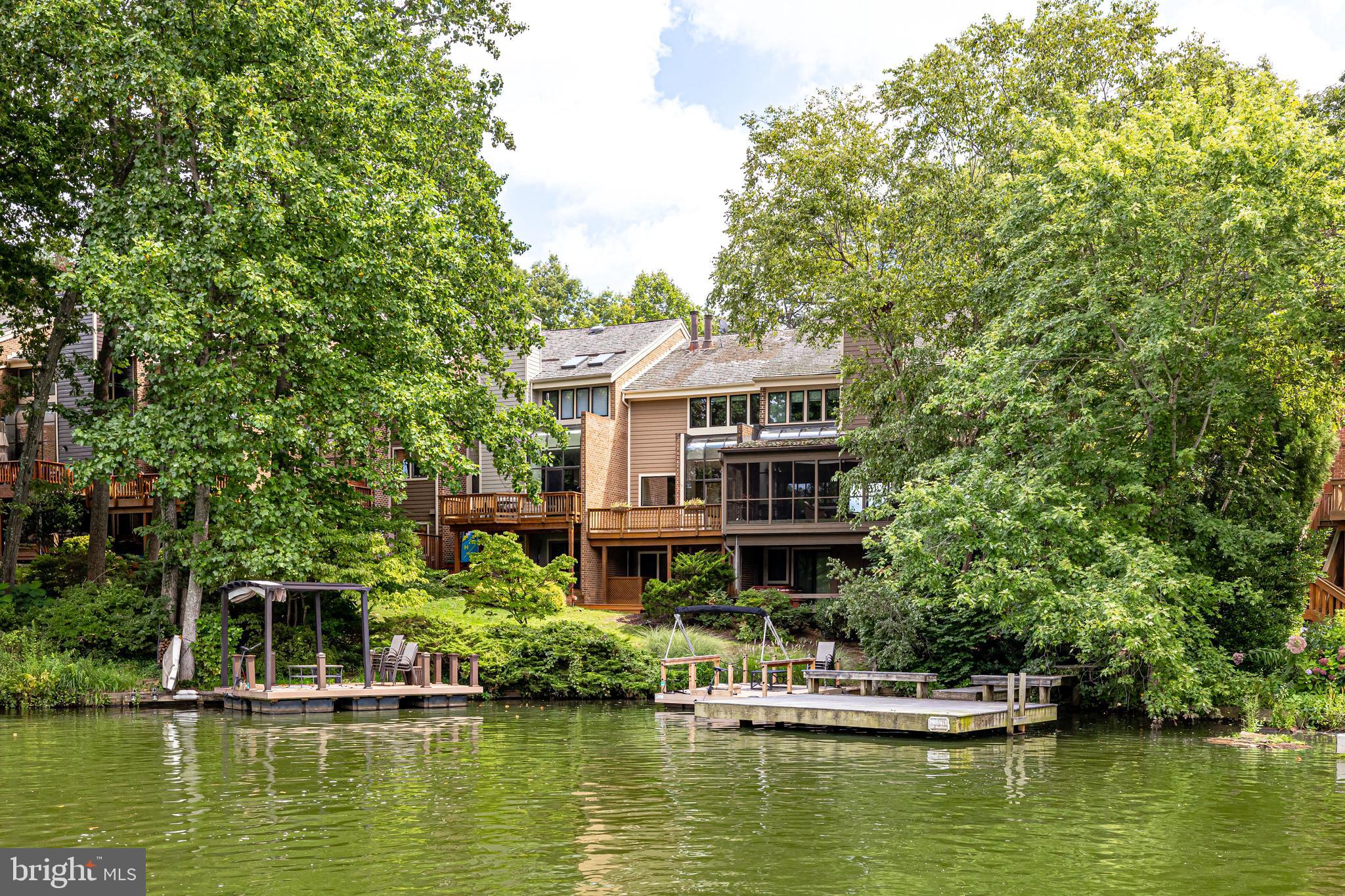 11056 Thrush Ridge Road Reston, VA 20191 - Photo 57 of 62 a house with a lake view