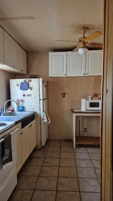 730 Stremma Road Largo, FL 33770 - Photo 4 of 7 a kitchen with a cabinets and counter space