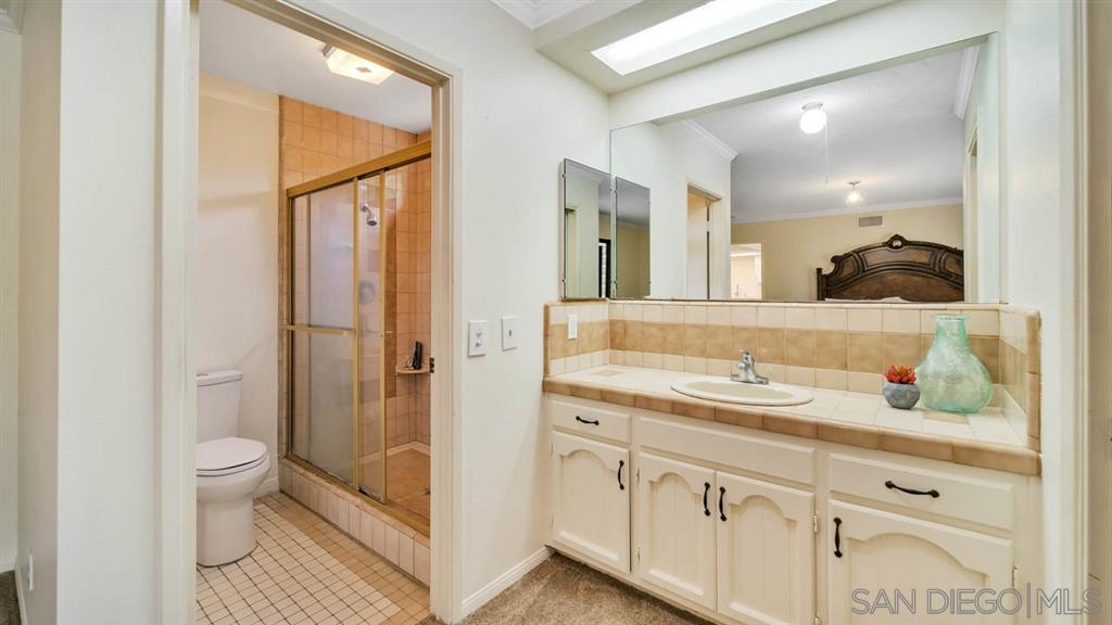 12842 Stone Canyon Road Poway, CA 92064 - Photo 16 of 25 cabinets newly painted, original tiles and shower