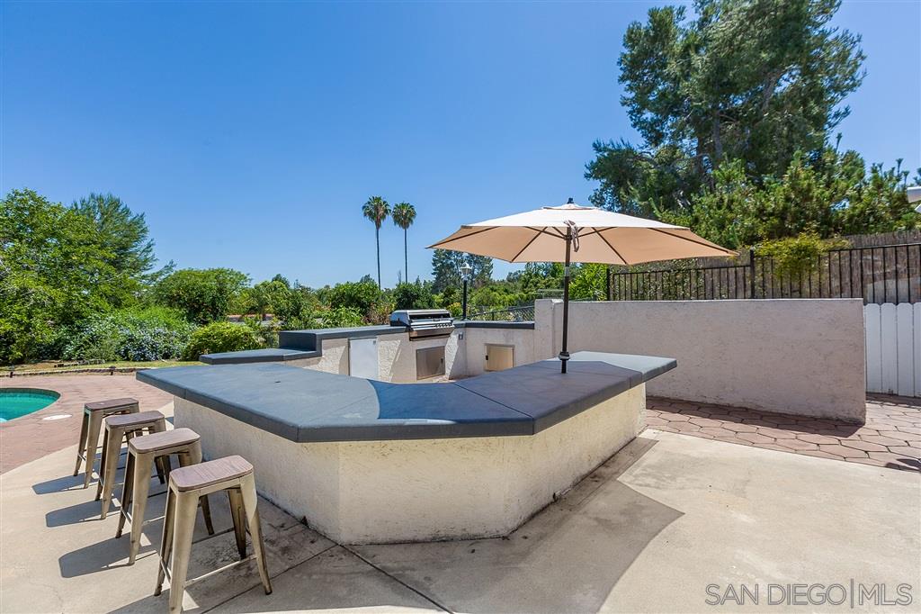 12842 Stone Canyon Road Poway, CA 92064 - Photo 19 of 25 Huge seating area built in with 2 umbrella stand holders