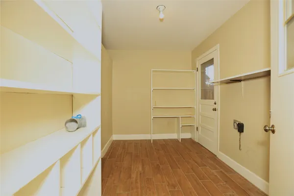 a view of a bathroom with a tub and shower