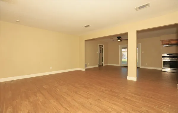 a view of a livingroom with a kitchen