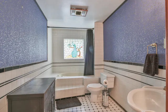 a bathroom with a sink toilet and bathtub