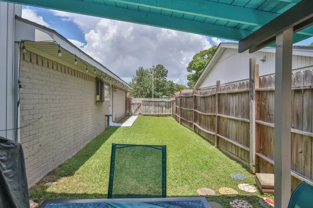 a view of a patio with couches chairs and a fire pit