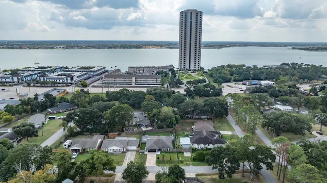 an aerial view of a house with a swimming pool