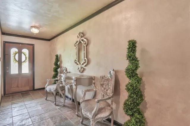 a living room with furniture a fireplace and a table