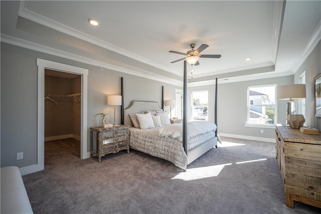 1719 Prospect Way Conyers, GA 30094 - Photo 12 of 18 a spacious bedroom with a bed and ceiling fan