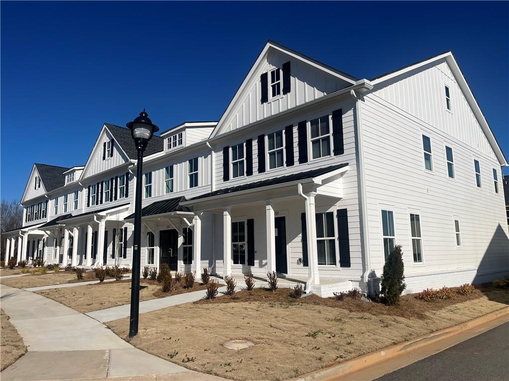 1719 Prospect Way Conyers, GA 30094 - Photo 2 of 18 a view of a white building among the street