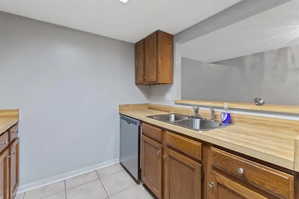 a utility room with sink dryer and washer