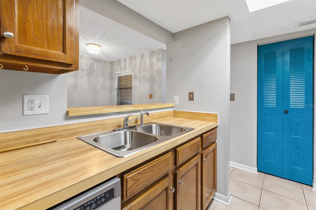 6926 Southwest 45th Avenue Gainesville, FL 32608 - Photo 13 of 28 a bathroom with a sink and a mirror