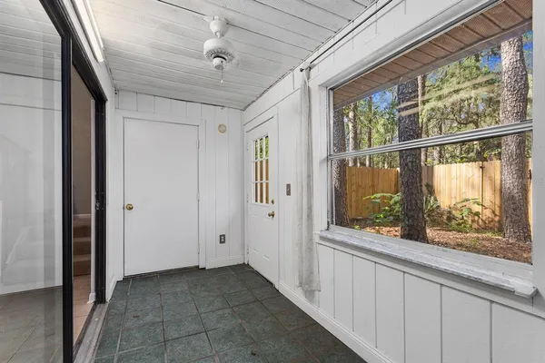 a view of hallway with windows