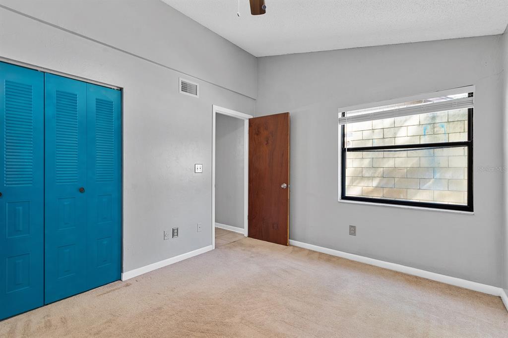 6926 Southwest 45th Avenue Gainesville, FL 32608 - Photo 15 of 28 a view of an empty room with closet and windows