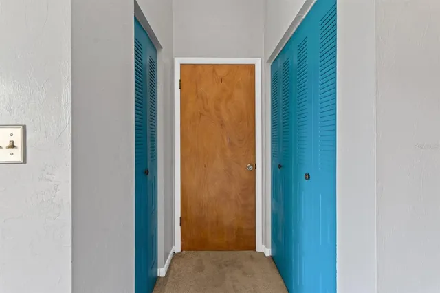 a view of hallway with closet