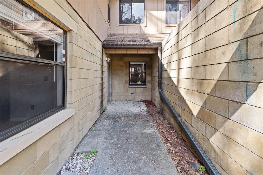 6926 Southwest 45th Avenue Gainesville, FL 32608 - Photo 2 of 28 a view of a pathway of a house