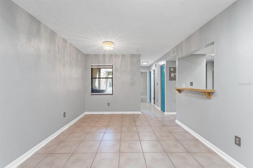 6926 Southwest 45th Avenue Gainesville, FL 32608 - Photo 4 of 28 a view of an empty room with window and stairs