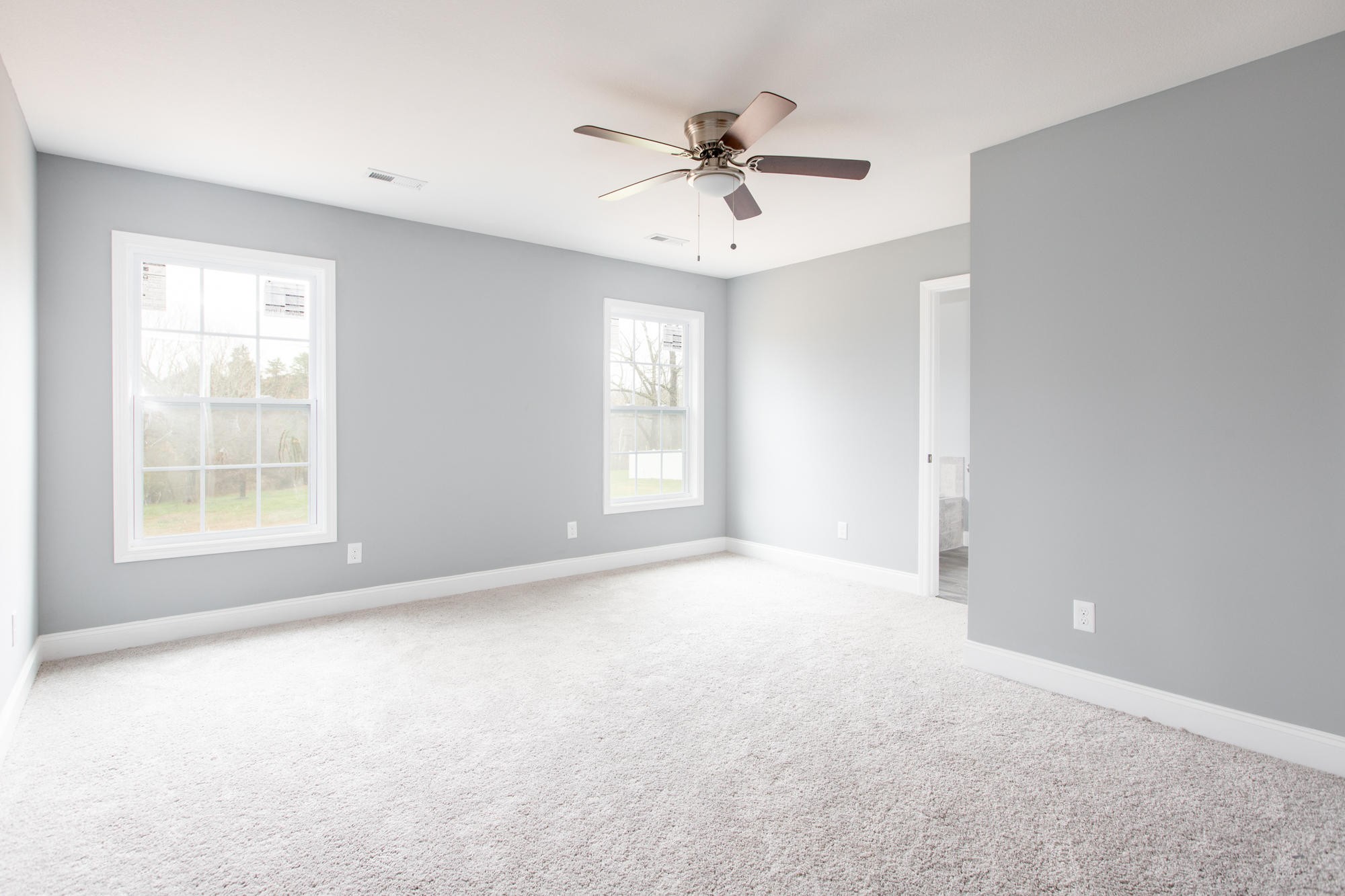 928 Houston Springs Road Greenback, TN 37742 - Photo 12 of 31 an empty room with windows and fan