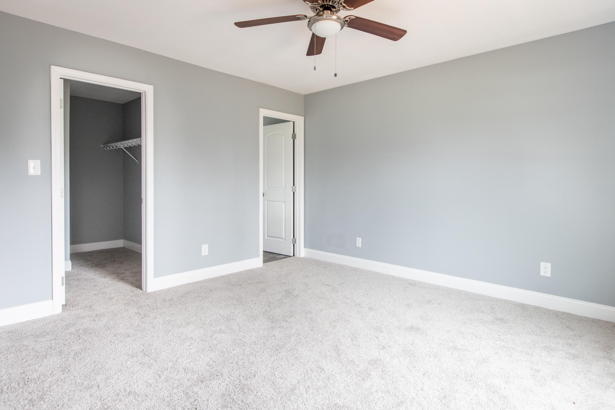 928 Houston Springs Road Greenback, TN 37742 - Photo 18 of 31 an empty room with a ceiling fan and carpet