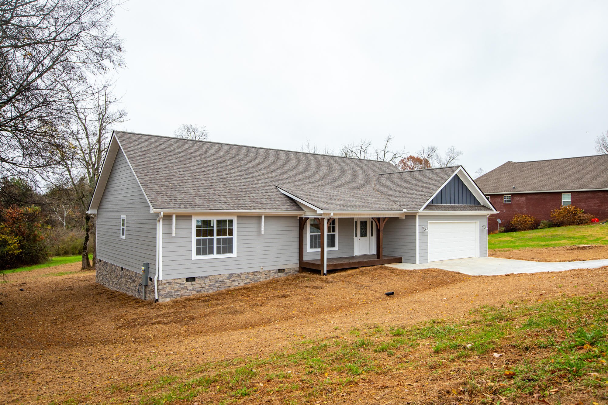 928 Houston Springs Road Greenback, TN 37742 - Photo 27 of 31 a front view of house with yard and trees around