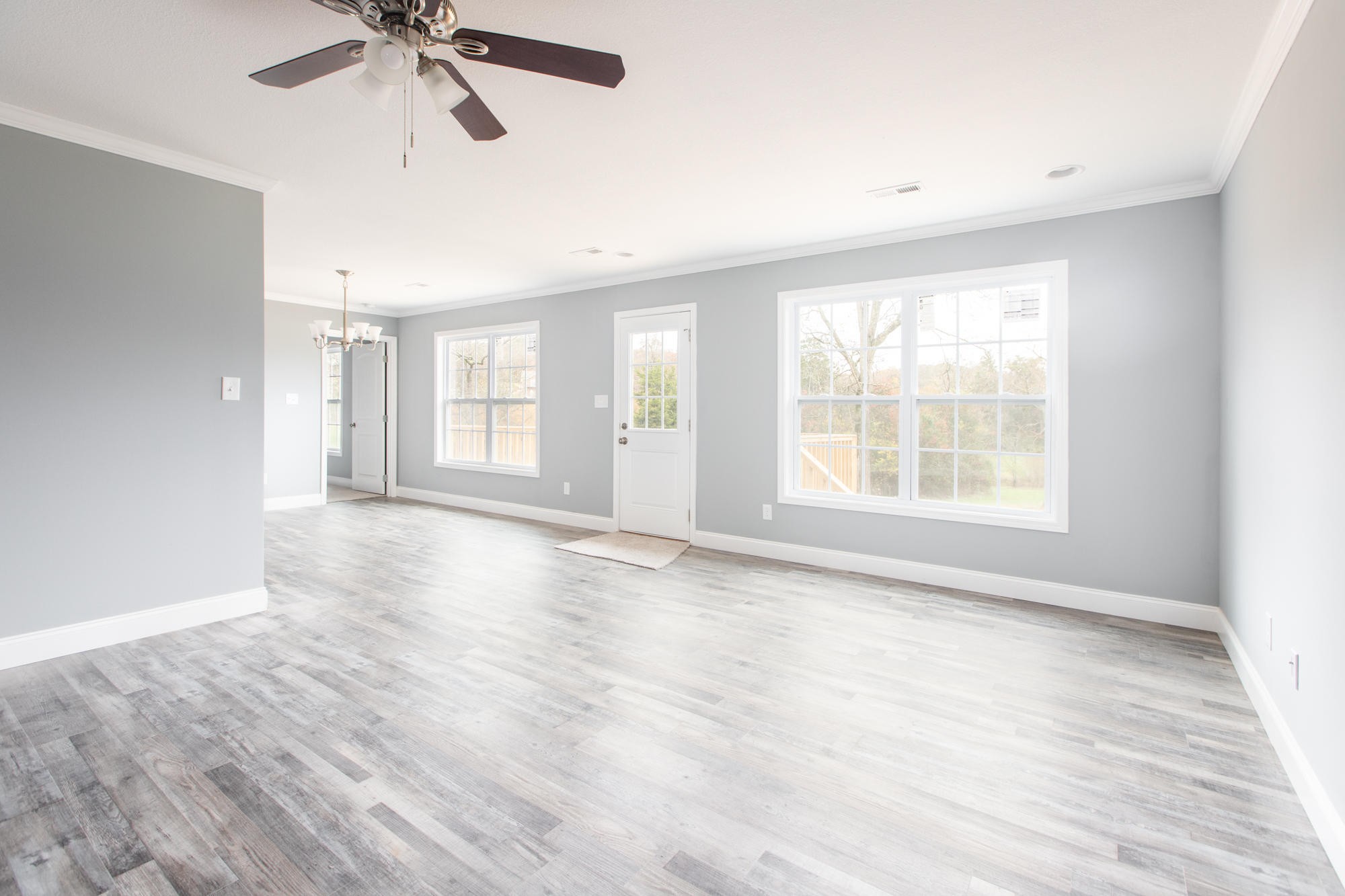 928 Houston Springs Road Greenback, TN 37742 - Photo 5 of 31 a view of an empty room with a window and wooden floor