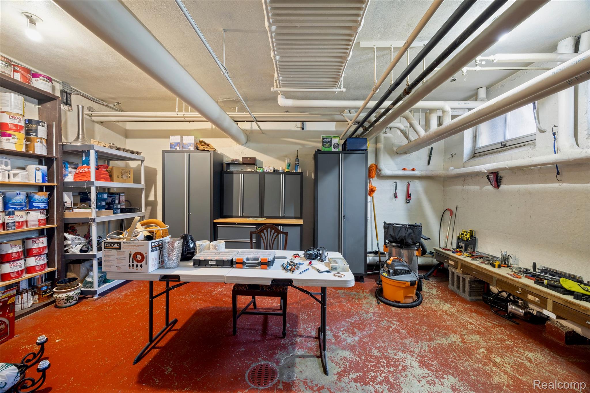 189 Cloverly Road Grosse Pointe, MI 48236 - Photo 66 of 93 A spacious lower-level workshop provides abundant room for projects, hobbies, organization, and estate maintenance, complemented by extensive built-in storage.