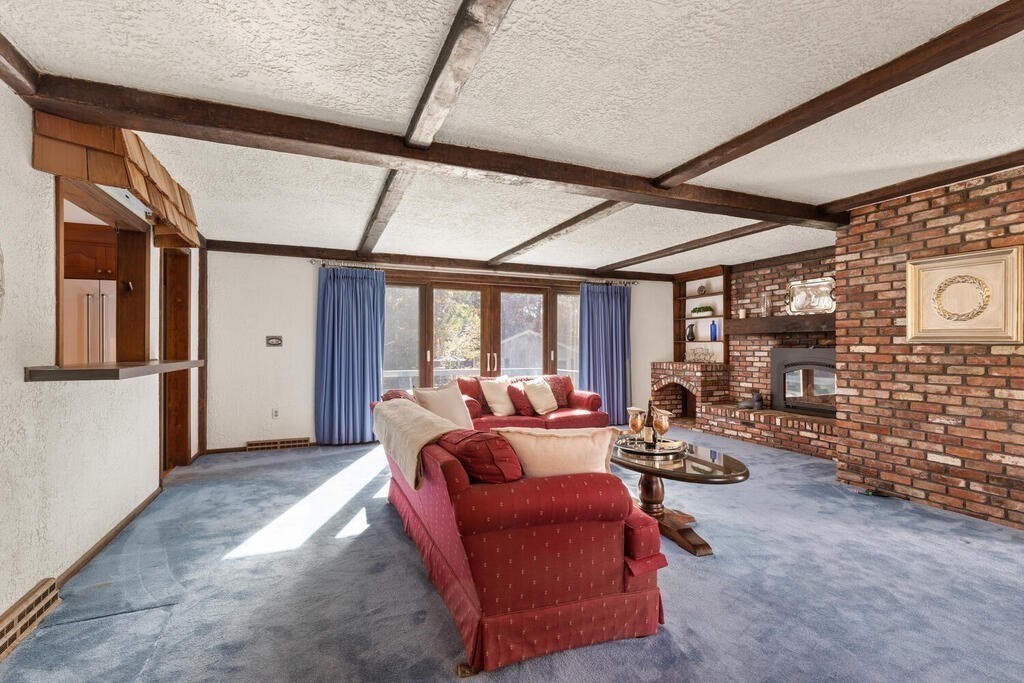 14 Parkerville Road Chelmsford, MA 01824 - Photo 13 of 34 a living room with furniture a couch and a floor to ceiling window