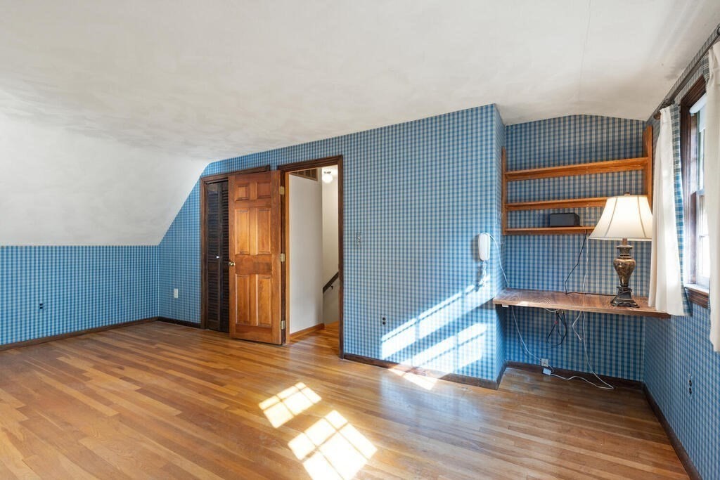 14 Parkerville Road Chelmsford, MA 01824 - Photo 23 of 34 a view of empty room with wooden floor and window