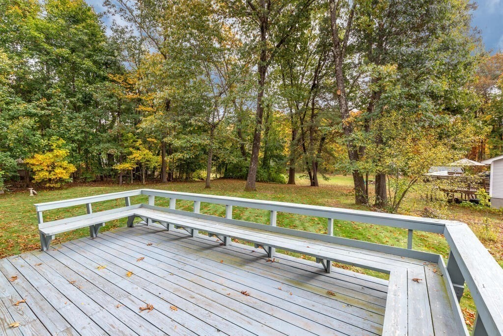 14 Parkerville Road Chelmsford, MA 01824 - Photo 29 of 34 a view of a balcony with wooden floor and fence