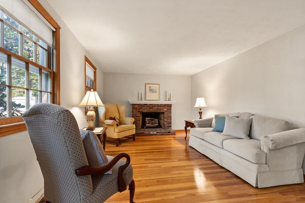 14 Parkerville Road Chelmsford, MA 01824 - Photo 6 of 34 a living room with furniture and a fireplace