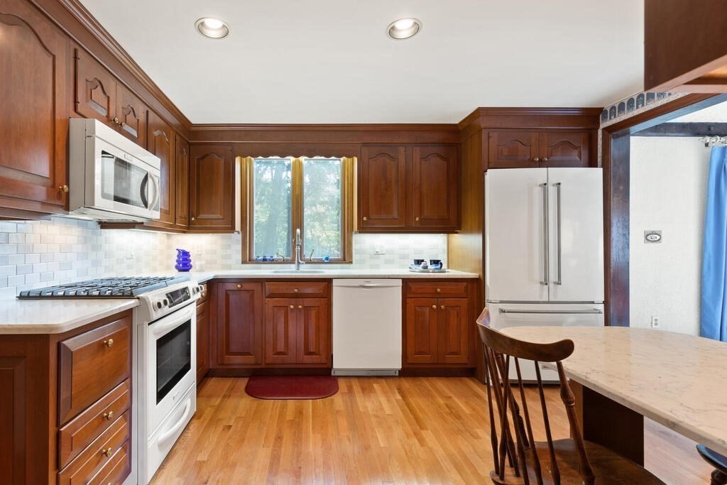 14 Parkerville Road Chelmsford, MA 01824 - Photo 10 of 34 a kitchen with granite countertop a stove a sink dishwasher and a refrigerator