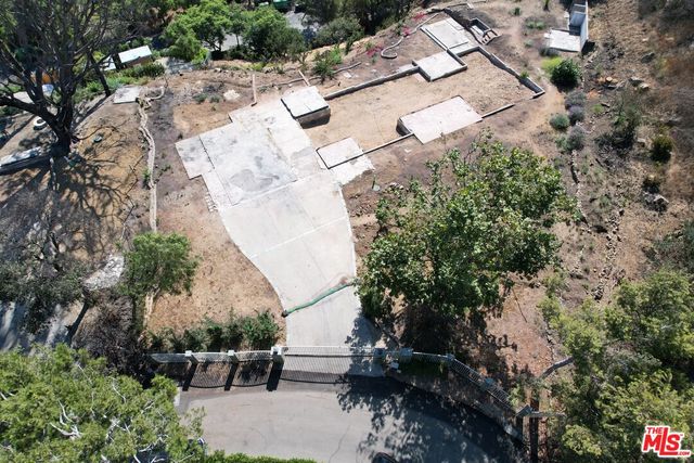 a view of balcony with chairs and wooden fence