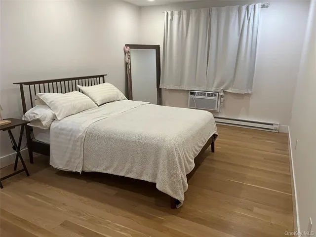 a bedroom with a bed and cabinets